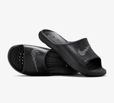 Get ready to conquer the day with the Nike Victori One Shower Slide. With a 1-piece foam design and traction patterns on the sole for wet surfaces, you'll feel comfortable and secure every step of the way. And don't worry about wet feet, these slides dry quickly so you can seamlessly transition from the shower to your next adventure. CZ5478-001 Sporty Non-slip Slides For Outdoor, Comfortable Slip-resistant Sports Slides, Comfortable Slip-resistant Slides For Training, Black Waterproof Slides For Outdoor, Non-slip Sports Slides Slip-on, Functional Black Slides For Outdoor, Functional Non-slip Slides With Round Toe, Sporty Non-slip Slides For Swimming, Sporty Non-slip Slides For Training