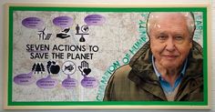 an old man is standing in front of a poster on the wall that says seven actions to save the planet