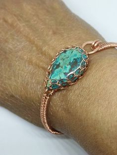 "This is a beautiful handmade piece created by Mimi.  This bracelet is made with a 16 and 26 gauge  bare copper wire and. It is weaved and the labradorite cabochon is Viking weaved. Two spirals fee the stone.. The circumference is approximately 2.5\". The length of the bracelet is about 7.5\".  The closure is hook and eye Copper has a natural oxidation that occurs over time. It really gives it an antique or vintage look. If you want a brighter look you can clean it with a simple solution of lemon and salt. Then rinse well in water." Wire Wrapped Stone Bracelet, Handmade Bohemian Copper Wire Jewelry, Unique Bronze Wire-wrapped Bracelets, Unique Bronze Wire Wrapped Bracelets, Unique Wire Wrapped Bronze Bracelets, Bohemian Wire Wrapped Jewelry In Copper, Bohemian Wire Wrapped Copper Jewelry, Bohemian Rose Gold Wire Wrapped Bracelets, Bronze Wire Wrapped Copper Bracelets