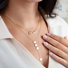 This beautiful 14k lariat necklace has 4 heart charms. Wear this by itself or layer it with another one of your favorite pieces.__________________________________________M A T E R I A L & L E N G T HAvailable in 14k Yellow Gold, 14k Rose Gold, 14k White GoldAdditional Notes:• Made in the USA Valentine's Day Charm Necklaces With Dangling Charms, 14k Gold Charm Necklaces With Dangling Charms, Dainty Necklace With Dangling Charms For Valentine's Day, Personalized Gold Lariat Jewelry, Dainty Valentine's Day Necklace With Dangling Charms, Elegant Valentine's Day Name Necklace With Charms, Dainty Necklace With Dangling Charms For Anniversary, Dainty Lariat Jewelry For Valentine's Day, Lariat Necklace With Charms As Gift