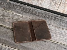 "Minimalist Wallet, Leather Bifold Wallet, Groomsmen Wallet, Unisex Card Wallet, Gender Neutral Wallet Features: * Slim design : 3\" x 4.5\" ( 7.8 cm x 11.4 cm) - Folded, * World's famous crazy horse leather, * Can hold up 6-8 cards and folded cash safely, * 2 hidden sleeves and 4 horizontal slots to hold Cards and folded cash, * It's a great gift for Wedding, groomsmen favor, corporate events, Christmas and graduation. -------------- Personalization: * limited space available; we can emboss up Groomsmen Favors, Engraved Money Clip, Leather Passport Wallet, Personalized Leather Wallet, Minimalist Leather Wallet, Leather Money Clips, Wallet Minimalist, Slim Leather Wallet, Handmade Wallets