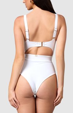 Inspired by vintage 60’s swimsuits, this ultra-flattering monokini is perfect for the classic beauty. The thick elastic in the waistband gives maximum tummy control for that classic hourglass figure. Adjustable straps – Shoulder and back clamp adjust for a more tailored fit Removable padding – To choose what fits you best Thick elastic waistband – Cinches in the waist Big bust and small bust friendly Cheeky bottoms – Most flattering cut to accentuate your bottom White Underwire Bodysuit For Poolside, White High Waist Lined Swimwear, White Beachwear Swimwear With Moderate Back Coverage, White High Waist Swimwear With Built-in Bra, White High-waist Swimwear With Built-in Bra, White Underwire Bodysuit For Swimming, White Underwire Bodysuit For The Pool, White Bodysuit With Built-in Bra For Pool, Swimming Wear