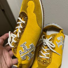 New Tory Burch Mustard Yellow Snickers Size 8.5 With Swarsovski Crystals Never Worn. Embellished Gold Sneakers With Round Toe, Gold Embellished Sneakers With Round Toe, Gold Embellished Round Toe Sneakers, Gold Embellished Lace-up Sneakers, Luxury Embellished Lace-up Sneakers, Luxury Leather Sneakers With Rhinestones, Embellished Leather Lace-up Sneakers, Luxury Sneakers With Rhinestones And Round Toe, Luxury Bedazzled Low-top Sneakers