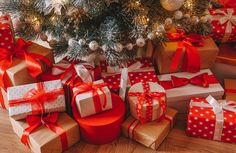 many wrapped presents under a christmas tree