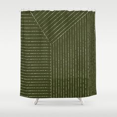 a green shower curtain with white lines on it