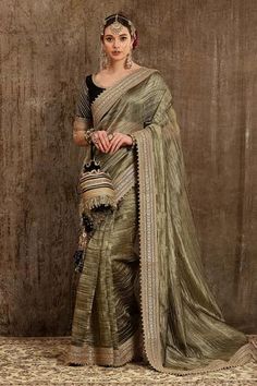 Shop for Shikhar Sharma Gold Woven Metallic Saree With Raw Silk Blouse for Women Online at Aza Fashions Luxury Art Silk Saree With Intricate Embroidery, Luxury Banarasi Silk Blouse Piece With Zari Work, Luxury Art Silk Saree With Padded Blouse, Luxury Raw Silk Pre-draped Saree With Zari Work, Luxury Chanderi Saree Blouse, Luxury Raw Silk Pre-draped Saree With Mirror Work, Luxury Slub Silk Choli With Zari Work, Luxury Raw Silk Traditional Wear With Printed Motifs, Luxury Raw Silk Choli With Tilla Details