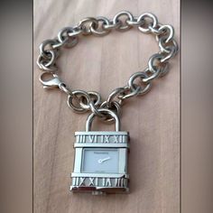 Like-New!Tiffany & Co Atlas Lock Swiss Watch Charm Link Bracelet Sterling Silver. Comes With Original Box And Dust Bag Formal Sterling Silver Jewelry With Palladium Hardware, Luxury White Gold Jewelry With Clasp, Timeless White Gold Jewelry With Palladium Hardware, Timeless Silver Jewelry With Clasp, Luxury Metal Jewelry With Box Clasp, Luxury Silver Engraved Watches, Timeless Jewelry And Watches With Jubilee Bracelet As Gift, White Gold Watch With Clasp As Gift, Timeless Jewelry And Watches As Gifts