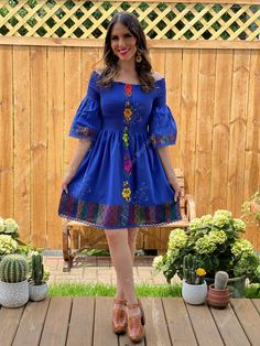 This Beautiful Dress boasts a Traditional Mexican floral design combined with a modern style dress. The elastic bodice combined with the bell sleeves makes it fun and flirty. It's made out of fine Mexican cotton and has elastic around the top for a tighter fit. This dress is handmade and hand embroidered by Mexican Artisans in Oaxaca, Mexico. This dress comes in one size: Small/Medium Purchase the shoes modeled here: https://www.etsy.com/es/listing/830412617/tacon-artesanal-de-bloque-zapato?ref= Spring Bell Sleeve Embroidered Dress, Spring Embroidered Bell Sleeve Dress, Fitted Blue Fiesta Dresses, Fitted Blue Dress For Fiesta, Blue Fitted Dress For Fiesta, Blue Bell Sleeve Summer Dress, Blue Bell Sleeve Dresses For Summer, Blue Summer Dresses With Bell Sleeves, Fitted Blue Dress With Bell Sleeves