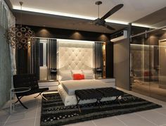 a bedroom with a white bed and black rugs on the floor in front of glass walls