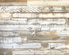 an old wood wall is painted white and brown