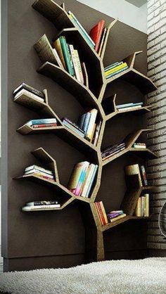 a tree shaped book shelf with books on it