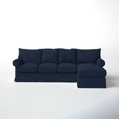 a blue couch and ottoman on a white background