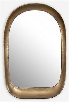 an oval mirror is shown in gold