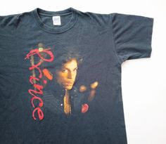 2004 Prince Musicology Live 2004ever Tour T Shirt  CONDITION good condition vintage Prince tour t shirt from 2004, shirt comes in beefy heavyweight soft cotton, barely visible cracks on print, size L on tag, please refer to measurement for accurate sizing, 100% preshrunk cotton assembled in Honduras of USA fabric. DETAILS Size On Tag: L Tag: Anvil MEASUREMENT pit to pit: 22 inches top to bottom: 27.5 inches SHIPPING your order will be shipped thru ASENDIA going out of originating country and you Tour T Shirts, Honduras, Philippines, Gender Neutral, Prince, Going Out, Graphic Tees, Bathing Beauties, Adult Outfits