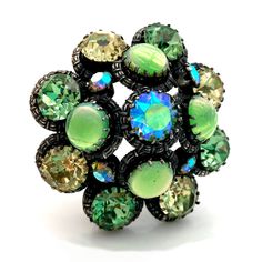 "Vintage Signed Austria High Quality Green Art Glass and Rhinestone Dome Brooch Stunningly beautiful. Absolutely breathtaking. Adorned with an enchanting green art glass cabochons and radiant peridot green, jonquil yellow, and aurora borealis rhinestones. Domed, layered design. Silver-tone finish. Mark: Signed MADE IN AUSTRIA in oval cartouche Age: Circa 1950s Condition: Rhinestones are present, bright, and truly dazzling! Aurora Borealis rhinestone in center is slightly askew in its setting. Fi Peridot Green, Layered Design, Enamel Flower, Green Art, Design Silver, Layers Design, Aurora Borealis, Modern Jewelry, Vintage Brooches