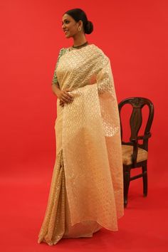 Gold brocade saree with resham and dori hand embroidery. Comes with an emerald green blouse - Aza Fashions Brocade Pre-draped Saree With Resham Embroidery, Wedding Tissue Silk Pre-draped Saree With Self Design, Festive Brocade Pre-draped Saree With Zari Work, Gold Brocade Pre-draped Saree With Zari Work, Brocade Pre-draped Saree With Zari Work, Elegant Brocade Pre-draped Saree For Designer Wear, Elegant Festive Brocade Pre-draped Saree, Fitted Brocade Saree With Resham Embroidery, Festive Brocade Pre-draped Saree With Dupatta