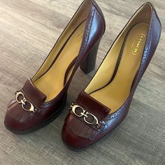 The Shoe Is A Burgundy Wine Color Platform With The Double C’s On Top With The Loafer Flap. Made With Quality Leather And The Heel And Platform Is Solid Wood. Elegant Coach Loafers For Work, Coach Elegant Formal Loafers, Elegant Coach Loafers For Office, Elegant Coach Loafers For Formal Occasions, Elegant Coach Loafers With Round Toe, Chic Formal Coach Loafers, Elegant Coach Block Heel Shoes, Elegant Coach Loafers For Fall, Designer Coach Heels For Formal Occasions