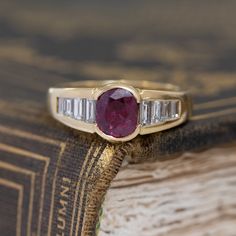 Talk about a gorgeous pop of color! The ruby has a deep and rich red color, contrasting beautifully against the white baguette diamonds. As sexy and sensous as only the French can make! A great choise for those looking for a non-diamond engagement ring. 18kt Yellow gold, size 6 & fully resizable.Ruby is estimated to be SI2/I1 type II clarity.Diamonds are estimated to be G/H colors & VVS/VS clarities.GIA standards.Please see qualitative report for more information. Non Diamond Engagement Rings, Bespoke Rings, Baguette Diamonds, Antique Engagement, Antique Engagement Rings, Ruby Diamond, Diamond Band, Baguette Diamond, Diamond Bands