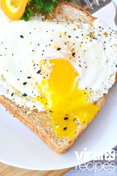 an egg is on top of bread with orange slices