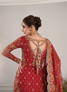 Pakistani Bridal Outfit in Kameez and Lehenga Style is an epitome of tradition and royalty. Hand-crafted details of dabka, zari, sequins, dabka, and naqshi make this beautiful Lehenga Dress an epitome of beauty and your foremost priority to have a head-turning magical look on the big day. Lehenga Kameez: The stunning kameez in an alluring red color is beautifully embellished with the intricate zardosi and fine details of embroidery, threads, motifs, dabka, naqshim, gold silver zari, and sequins. Premium quality cotton net fabric and perfect stitching make this Pakistani Bridal Dress a perfect choice to have a gorgeous wedding look. Bridal Lehenga: The embellished kameez is paired with Bridal Lehenga, creating a lavish Pakistani Bridal Outfit. The Farshi Lehenga has an alluring purple shade Farshi Lehenga, Day Lehenga, Lehenga Kameez, Bridal Lehenga Pakistani, Pakistani Bridal Lehenga, Beautiful Lehenga, Lehenga Dress, Pakistani Bridal Dress, Bridal Dupatta