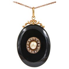 Memories Keeper Superb Victorian period 1880 ca, large carved Onyx locket pendant with scroll open work at the top side further embellished with centre – not nucleated Natural Sea Pearl – nestled into a halo of Rose cut Diamonds for a dramatic visual look Made of 18 Kt gold including the back window frame Onyx is skilfully hand carved, natural pearl is slight off shape but pretty large in size ( 8 x 6.6 mm.) outstanding in its individuality for goldish colour and unique shape prizing rare silky sheen and natural iridescence proper to natural pearls Rose cut Diamonds for approx .45 CT - by spread Window is foiled with Purple colour Silk , original glass , all in perfect order and kept in pristine condition Antique mourning jewellery is chic and fashionable easy wear on jeans or evening outf Black Locket, Victorian Period, Pearl Rose, Onyx Necklace, Sea Pearl, Natural Pearl, Water Pearls, Old Jewelry, Window Frame