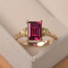 Vintage Ruby and Opal Engagement Ring Emerald Cut Three - Etsy Elegant Three Stone Lab-created Ruby Jewelry, Three Stone Lab-created Ruby Fine Jewelry, Elegant Three Stone Jewelry With Lab-created Ruby, Fine Jewelry With Three-stone Lab-created Ruby, Fine Jewelry With Three Stone Lab-created Ruby, Fine Jewelry With Lab-created Ruby And Three Stones, Three Stone Lab-created Ruby Jewelry As Gift, Family Birthstone Ring, Engagement Ring Emerald Cut