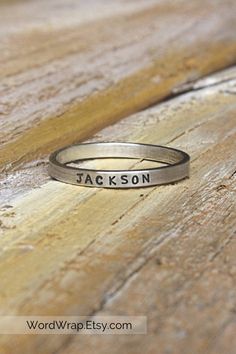 These extra tiny minimalist name rings are simple enough to wear every day, and also perfect for stacking and layering. They make the perfect bridesmaid gift, mother's day gift, and are also great for birthdays, graduation or any special event! These custom rings can be personalized with hearts, names or numbers that are meaningful to you. Layer them together or with other stackable rings for a look as unique as you are. Details: ~ Ring width: 2mm ~ Ring thickness: 1mm ~ Letter size: 1mm ~ Made Custom Name Adjustable Stackable Rings, Everyday Stackable Rings With Custom Name, Adjustable Stackable Rings With Custom Name, Adjustable Engraved Stackable Ring For Everyday, Adjustable Personalized Stackable Rings, Everyday Adjustable Stackable Engraved Ring, Minimalist Stackable Rings With Custom Name For Anniversary, Custom Name Rings For Everyday, Custom Name Rings For Everyday Wear