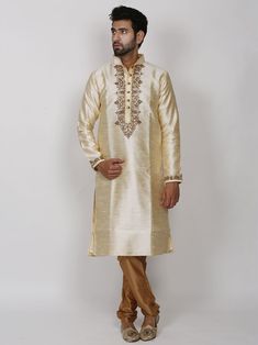 Silk Kurta pyjama With Hand Work & zari work to enrich its style with a beige/Golden colour lower to embellish your occasion This is Beautiful dress can be worn on any occassions like wedding,sangeet,reception or any religious festival Festive Bollywood Churidar With Naqshi Detailing, Traditional Long Sleeve Sherwani For Puja, Transitional Straight Kurta For Traditional Ceremonies, Bollywood Churidar With Straight Kurta For Traditional Ceremonies, Festive Sherwani With Dabka Work For Puja, Bollywood Churidar For Traditional Ceremonies, Festive Dabka Work Sherwani For Puja, Straight Kurta Sherwani With Zari Work For Puja, Straight Kurta Churidar For Navratri And Traditional Ceremonies