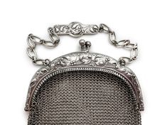 Beautiful silver mesh purse made during the Art Nouveau period in France, so likely between 1895 and 1914. I believe it to be 800 silver as it has marks on the clasp that appear to be Boar's Head marks. It is also stamped Depose. The mesh is fine and in excellent condition--around the hinges as well. There is a silver plaque on the chain and pendant balls along the bottom complete the look. The design is graceful and charming--intertwined branches of mistletoe. Dimensions: Purse is 6 1/2" long x Chain And Pendant, Sales Tax, Mesh Bag, Clutch Handbag, Hinges, Evening Bags, Made In France, Purses And Handbags, Antique Silver