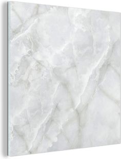 a white marble textured wall with black trim