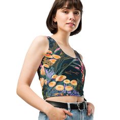 Look fabulous in an all-over printed, body-hugging crop top, now offering FREE SHIPPING to the US, Canada, EU, and UK! The artwork This artwork is an enchanting portrayal of Alpine flowers, set in a serene mountainous landscape. It captures a diverse array of wildflowers blooming amidst rocky terrains and dark, lush foliage. The painting features a rich palette of soft oranges, pinks, yellows, and purples, reflecting the delicate beauty and variety of flowers found in high-altitude regions. The Floral Print Stretch Cropped Top, Printed Multicolor Cropped Top, Stretch Floral Print Cropped Top, Multicolor Printed Cropped Crop Top, Multicolor Printed Cropped Top, Stretch Cropped Floral Print Crop Top, Spring Patterned Tops With Digital Print, Fitted Multicolor Floral Print Crop Top, Fitted Green Crop Top With Graphic Print