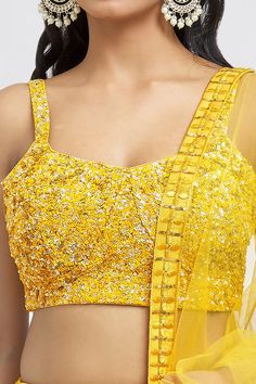 Mustard attached cancan lehenga with all over embroidery using sequins, mirror and thread work. Paired with a sequin embroidered padded blouse and dupatta. - Aza Fashions Fitted Pre-draped Saree With Gota Work For Party, Sequined Fitted Lehenga In Chinon, Fitted Chinon Choli With Sequins, Fitted Sequined Choli In Chinon, Fitted Sequin Chinon Lehenga, Fitted Sequined Chinon Choli, Sequin Saree Choli For Diwali, Bollywood Style Sequined Choli In Chinon, Sequin Choli For Diwali