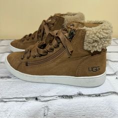 Elevate Your Casual Style With These Ugg Women's Olive Chestnut Hightop Lace Up Booties. These Ankle Boots Feature A Low Heel Height, Zipper Closure, And Lace-Up Closure To Provide A Comfortable And Secure Fit. The Brown Leather Upper Material And Leather Insole Material Add A Touch Of Luxury To These Boots. Never Used, See The Picture For Details Size:6 Side Zip Closure; Lace-Up Style Eva-Cushioned Insole Genuine Shearling And Leather Upper/Leather And Uggpure Wool Lining/Rubber Sole Imported W Casual Outdoor Sneakers With Zipper Closure, Ugg Womens, Lace Up Booties, Womens Uggs, Ugg Shoes, Low Heels, Chestnut, Side Zip, Casual Style