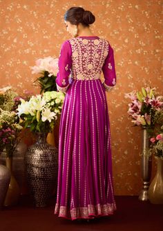 Step into refined elegance with the imperial purple anarkali suit adorned with gold appliqué on silk brocade. This luxurious ensemble features intricate gold detailing, an embroidered belt that cinches the waist, and a lightweight silk organza dupatta for added grace. The perfect blend of regal charm and contemporary sophistication, ideal for any festive celebration. Purple Anarkali, Imperial Purple, Gold Applique, Embroidered Belt, Casual Tunics, Organza Dupatta, Anarkali Suit, Silk Brocade, Silk Organza