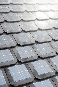 rows of solar panels on the roof of a building