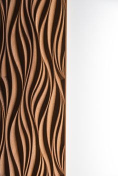 an abstract wooden panel with wavy lines on it's sides and a white background