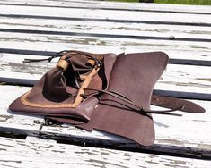 We proudly present this typical medieval men's belt bag, hanging on two loops. It's made mainly of calfskin, but pouches are made of soft goat suede. Purses like this were used in every social group, but a wealthy man could afford a decorated or more sophisticated bag. This purse is rather simple, it has a single compartment and a flap. This version has a fastening strap with a buckle made of brass. This buckle was found in Dordrecht in The Netherlands. It's dated 1350-1600. At the front, The ba Medieval Leather Pouch For Larp, Medieval Style Leather Pouch Bags, Medieval Bag, Forearm Guard, Mounted Archery, Wealthy Man, Leather Belt Pouch, Wealthy Men, Men's Belt