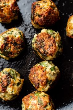 some food that is sitting on a black plate and has been cooked in the oven