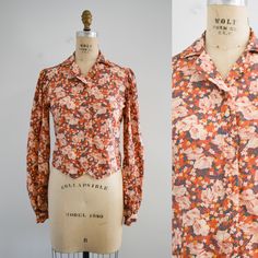 "Description: 1970s poppy print blouse. 60% viscose, 30% polynosic, 10% cotton. Button front. Long sleeves with gathered shoulders. V pointed front hem. Condition: In fair to good condition, with no stains. It has a few small holes in the back. Laundered. Designer: Jeff Banks  Stated size: 12 Measurements: Armpit to armpit: 18\"  Shoulder to shoulder: 15\"  Sleeve length: 26\"  Overall length: 18\"  Waist: up to 32\" ---> If you need an order shipped by a particular date or shipped via a quicker method, please ask PRIOR to purchase to see if we can accommodate that request. Visit the rest of our shop for more goodies ---> https://www.etsy.com/shop/BlackbirdAntiquesNC Visit our shop policies page for sizing info, shipping guidelines, and more ---> https://www.etsy.com/shop/BlackbirdAntiques Sewing Tape Measure, Boucle Sweater, Poppy Print, Wool Pencil Skirt, Cream Sweater, Print Blouse, Cotton Blouses, Sweater Coats, Shop Policies