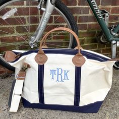 Whether you're off on business, visiting family and friends for the weekend, or headed off to college in need of a large accommodating duffel (with embroidered monogram, of course), the Weekender is your go-to travel bag. 15" H x 28" W x 10" D. 20 oz heavy canvas designed to hold its shape. Top zip closure. Internal organizer featuring 2 smaller open pockets attached to a larger pocket with a zip closure. Two leather handles with detachable and adjustable shoulder strap with leather padding. Nee Classic White Rectangular Weekender Bag, Cream Weekender Tote Bag For Travel, White Travel Bag With Embroidered Logo, White Duffle Bag For Overnight Trips, Cream Tote Duffle Bag For Travel, White Monogram Bag For Travel, White Monogram Travel Bag, Classic Rectangular Bags With Embroidered Logo, Off To College