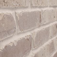 a white brick wall with no mortar on it