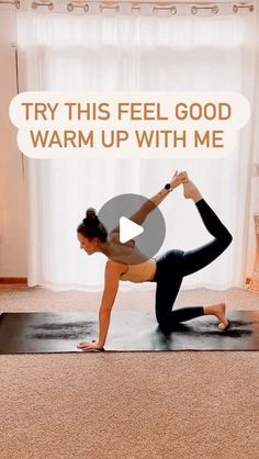 a woman is doing yoga on a mat with the words try this feel good warm up with me