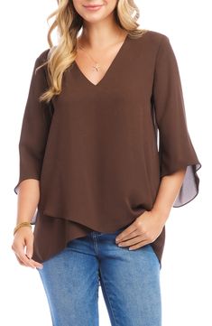 An elegant top of silky, lightweight crepe delivers elegant movement with its angled flare sleeves and fluttery asymmetrical hemline that dips low in back. 25 1/2" length (size Medium) V-neck Three-quarter sleeves Back yoke with gathering Crossover high/low hem 100% polyester Dry clean or hand wash, line dry Made in the USA of imported fabric Women's Clothing Flowy Asymmetrical Hem Blouse For Spring, Flowy Blouse With Asymmetrical Hem For Spring, Flowy Spring Blouse With Asymmetrical Hem, Chic Flowy Blouse With Asymmetrical Hem, Elegant Blouse With Draped Asymmetrical Sleeves, Elegant Asymmetrical Blouse With Draped Sleeves, Chic Asymmetrical Drapey Tops, Elegant Flowy Solid Color Top, Elegant Asymmetrical Drapey Tops