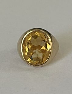 Signet ring in yellow gold (18k) centered with a faceted oval citrine in a closed setting. HB spread wings eagle hallmark and eagle head hallmark. Tray: 17 x 15 mm. Gross Weight: 14.42 g. Size: 48.5 Possibility of sizing, contact us. Further information : We issue an invoice as well as a certificate of authenticity established by our qualified gemologist (LFG Paris). Our photos are not reworked and are taken in a natural light environment. We can send you a short video upon simple request. Each Classic Oval Yellow Gold Gemstone, Classic Round Gold Gemstones, Yellow Oval Topaz Ring In 14k Gold, Formal Oval Topaz Ring With Polished Finish, Classic Oval Hallmarked Gemstones, Classic Gold Gemstones With Polished Finish, Classic 14k Gold Gemstones, Elegant Citrine Gemstone Signet Ring, Yellow Gold Gemstone Signet Ring For Collectors