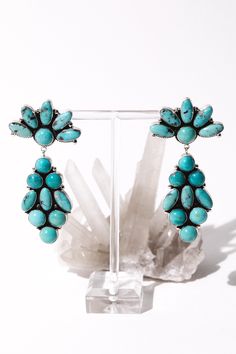 Handcrafted Native American statement earrings adorned with vibrant Campitos Sonoran Mountain turquoise stones. Campitos turquoise is highly vibrational and abundant with healing properties. The stone aids with spiritual attunement and balances energies within the body. 'Chimalus' is a Native American name meaning bluebird. This piece was handcrafted and sourced from a Native artisan. ✦ Measure 3.25 inches long x 1.5 inches wide / Sterling Silver Signed *C.Wylie / Stamped* Sterling Turquoise Statement Earrings, Past Love, Silver Statement Earrings, Name Meaning, Turquoise Stones, Wild Child, Bluebird, Healing Properties, Silver Turquoise