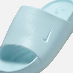 Style No. FV5940-400 Color: Glacier Blue/Glacier Blue Made with soft yet supportive foam, the minimal design makes these slides easy to style with or without socks. And they’ve got a textured footbed to help keep your feet in place. To top it off, this special edition features an iridescent finish. Nike Calm SE Women's Slides. Womens Slides, Minimal Design, Christmas List, Nike Women, Slides, Socks, Nike, 10 Things, Christmas