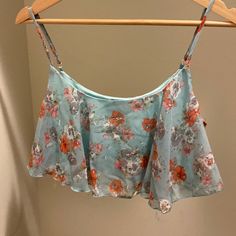 Never Worn, Still Has Original Tags. Bought From Mandees. Uk2la Blue Floral Crop Top Size L Light Blue Summer Crop Top, Casual Light Blue Crop Top For Vacation, Light Blue Casual Beach Crop Top, Sleeveless Light Blue Floral Print Top, Blue Cami Crop Top For Vacation, Blue Cami Crop Top For The Beach, Blue Cami Crop Top For Beach, Light Blue Cropped Summer Crop Top, Light Blue Cami Crop Top For Summer