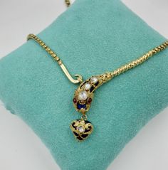 Antique Snake Necklace Rose Cut Diamond 14 Karat Gold Blue Enamel Garnet 1840 For Sale at 1stdibs Antique Yellow Gold Jeweled Necklaces, Antique Yellow Gold Necklaces With Jewels, Antique Yellow Gold Necklace With Historical Design, Antique Necklace With Historical Design For Formal Occasions, Antique Necklace With Historical Design For Formal Events, Ceremonial Yellow Gold Necklace With Historical Design, Elegant Locket Necklace For Ceremonial Occasion, Antique Yellow Gold Necklaces With Rose Cut Diamonds, Ornate Yellow Gold Necklace With Jewels