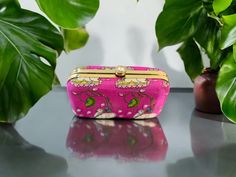 Feel special with this beautiful, embroidered clutch. Attractive & affordable fashion accessory designed using rich fabric and intricate work. Perfect for gifting on occasions like baby shower, housewarming, wedding, sangeet, return gift, griha pravesh pooja, Diwali, Holi, Ganpati, Dussehra, Durga pooja, Laxmi Pooja, Eid, Ramadan, Gudi Padwa, Onam, Pongal, Ugadi, Navratri etc. The Pichwai designs are one of the most ancient forms of paintings with origin from Rajasthan. This design usually depic Pichwai Designs, Laxmi Pooja, Durga Pooja, Gudi Padwa, Eid Ramadan, Embroidered Clutch, Return Gift, Haldi Ceremony, Baby Shower Backdrop