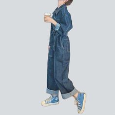 Be transported back to the Pre-millennium with our 2023 Spring-Summer Collection medium wash baggy denim overall! A timeless classic with modern day flair. this one-of-a-kind piece will have you feeling nostalgic and looking fashionably hip. Crafted from luxe denim and featuring a bold buttoned closure. this overall exudes retro chic sophistication.Distinctive Features: 90s Style: Relive the 90s in style with this classic denim overall. Medium Wash: A timeless wash that adds a touch of effortles Blue Straight Leg Utility Denim Jumpsuit, Denim Blue Straight Leg Jumpsuit With Pockets, Blue Utility Denim Jumpsuit With Straight Leg, Trendy Denim Overall Jeans, Wide Leg Denim Jumpsuit With Pockets, Casual Baggy Dark Wash Denim Jumpsuit, Casual Denim Blue Overall Jeans, Casual Denim Blue Jean Overalls, Blue Denim Utility Jumpsuit